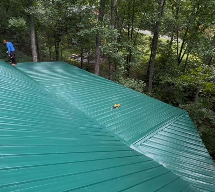 metal roofers Clinton TN project showing completed roofing panels and ridge details
