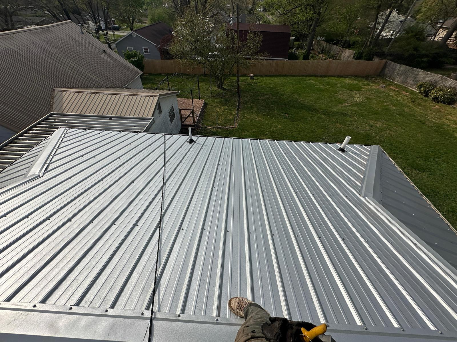 Finished metal roof with aligned panels and coordinated exterior details